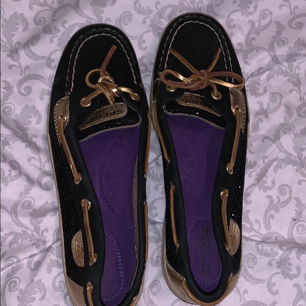 Black and gold Sperry shoes